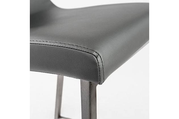 Designed with an elegant, contemporary flair, this Scott Counter Stool is a study in stylish form and delightful function. Featuring a soft leatherette seat and back and square brushed stainless-steel frame, legs and footrest, this unpretentious stool fits into any home or business environment.Soft leatherette over foam seat and back | Square brushed stainless steel legs | Plastic feet