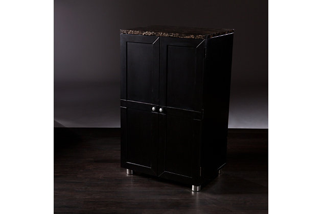 Classy and convenient, this bar cabinet is perfect for entertaining in any size room. The marbleized countertop and painted black finish exude elegance in its space-saving design. This bar cabinet is smartly compact yet amply stores stemware with five hanging racks, and can accommodate up to 20 wine bottles. The large drawer is perfect for wine openers or accessories, and four door shelves feature stainless steel guardrails to securely store bottles and glassware.Made of engineered wood, faux marble, stainless steel and nickel | Marbleized countertop for elegant style | Space-saving design | Accommodates up to 20 wine bottles | Assembly required | Assembly time frame is 45 to 60 min.
