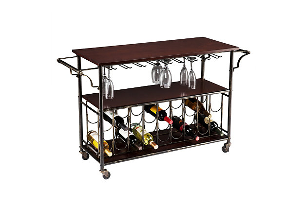 No need to worry if the party moves from the kitchen to the dining room; tasty treats and libations will never be far behind with this trendy bar cart. The black and brushed goldtone frame supports espresso-colored shelves to serve your needs. And with room to hang 18 glasses and 18 wine bottles, you can be sure the good times will flow.Black iron frame with engineered wood | Shelf and spacious countertop for serving and storage | Holds 18 bottles/18 glasses (9 glassware racks) | 2 towel racks | Smooth-gliding casters for easy mobility | Assembly required | Assembly time frame is 15 to 30 min.