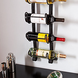 Make use of spare wall space while showing off your favorite bottles with this wall mount wine rack. In a natural wrought-iron finish, the open metal design draws attention to your most coveted wine labels for a truly one-of-a kind artwork.Made of metal | Natural wrought-iron finish | Functional, decorative wall sculpture | Transforms wine storage into wall art | Accommodates 5 standard wine bottles | No assembly required