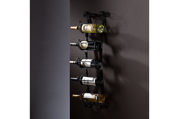 Make use of spare wall space while showing off your favorite bottles with this wall mount wine rack. In a natural wrought-iron finish, the open metal design draws attention to your most coveted wine labels for a truly one-of-a kind artwork.Made of metal | Natural wrought-iron finish | Functional, decorative wall sculpture | Transforms wine storage into wall art | Accommodates 5 standard wine bottles | No assembly required