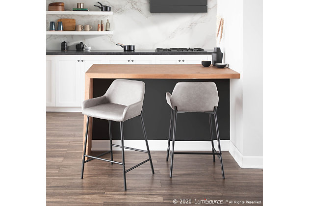 Add stylish and comfortable seating to your kitchen or counter area with the industrial charm of this counter stool. It features sleek faux leather upholstery, a padded seat and backrest, and a unique black metal frame.Set of 2 | Made of steel, vinyl leather, foam and birch | Padded seat and backrest with gray faux leather upholstery | Metal frame with black finish | Fixed counter height | Assembly required