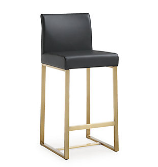 Furnish your kitchen or bar area in contemporary style with the Denmark counter stool. The goldtone solid stainless steel frame provides a sturdy base, while the plush seat and footrest ensure maximum comfort. The combination of angles and gentle curves gives this stool an eye-catching appearance and the neutral color allows it to match well with any decor.Stainless steel frame and footrest | Comfortable faux leather upholstered back and seat | Ships 2 per carton | For residential or commercial use | Available in black or white and counter and bar height options | Assembly required