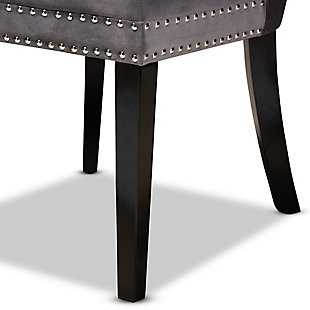 Outfit your dining space with the glamorous Remy dining chair. Set on top of sleek black legs, this oak wood chair is upholstered in a sumptuous velvet fabric that feels exceptionally soft to the touch. Elegant button tufting accentuates the sheen in the velvet, while silver nailheads add a modern touch to the classic silhouette. This versatile chair makes a comfortable seating option in your dining space, as well as a stylish accent piece in your living room or entryway. The Remy dining chair is made in China and requires assembly.Modern and contemporary set includes two (2) dining chairs | Constructed from oak wood and stainless steel | Espresso brown finish | Upholstered in velvet polyester fabric and padded with foam