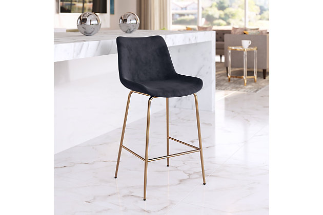 This counter height bar stool mixes glam and maximalist design to enhance any space, from modern to boho chic. With a firm seat and back upholstered in smooth velvet fabric, and a solid steel frame with goldtone finish, this piece takes form and function to another level. Perfectly suited for any kitchen or bar area in your living space.Made of engineered wood, polyester and steel | Black velvet upholstery | Legs with electroplated goldtone finish | Counter height | Weight capacity 325 pounds | Assembly required