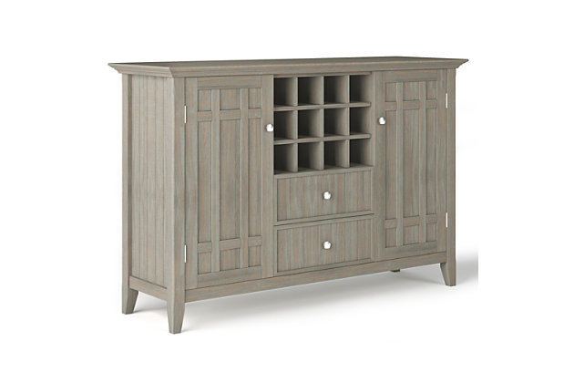 Need help in the dining room? This rustic sideboard buffet and wine rack is up to the job in a casual way. You'll find the moulded tabletop, beaded drawer fronts and sides, cabinets, wine rack and shelves handy for organizing dining essentials and keeping them within reach. It's hand-finished in gray with protective lacquer to accentuate and highlight the grain and uniqueness of each piece. This multi-functional storage cabinet can be used in the living room, family room or dining room.DIMENSIONS: 17" D x 54" W x 36" H | Handcrafted with care using the finest quality solid wood | Hand-finished in a Distressed Grey and a protective NC lacquer to accentuate and highlight the grain and the uniqueness of each piece of furniture. | Multi-Functional storage cabinet can be used in living room, family room and dining room | Features two (2) central drawers with metal glides, two (2) side doors that open to large storage spaces with two (2) shelves each and a twelve (12) bottle wine storage rack. | Transitional style includes molded table top, beaded drawer fronts and sides, solid panel doors and Bronze rounded square knobs | Assembly Required | We believe in creating excellent, high quality products made from the finest materials at an affordable price. Every one of our products come with a 1-year warranty and easy returns if you are not satisfied.