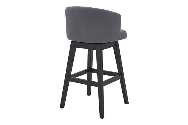 The Armen Living Celine wood barstool is an excellent choice for the transitional or contemporary household. Constructed from a combination of eucalyptus and birch wood frame that is certain to maintain its durability for many years to come. The Celine’s legs feature an Espresso wood finish and the plump, foam padded seat and back of the barstool are upholstered in grey fabric. The back of the Celine is rounded and features tufted accents that add a unique aesthetic accent to the piece. The barstool’s 360 degree swivel function allows for a wide range of movement while seated and the included footrest provides added comfort and support. The Celine’s legs are tipped with floor protectors, assuring that the barstool will not damage floors when moved. The Celine is sold in two industry standard sizes; 26 inch counter and 30 inch bar height. This wood barstool is available in gray or tan fabric.Celine contemporary bar or counter stool in espresso wood finish and grey or tan fabric | 360 degree swivel function allows for enhanced mobility while seated | Tufted back design is aesthetically pleasing and enjoyable | Product dimensions: 21"w x 21.5"d x 35"h sh: 26"