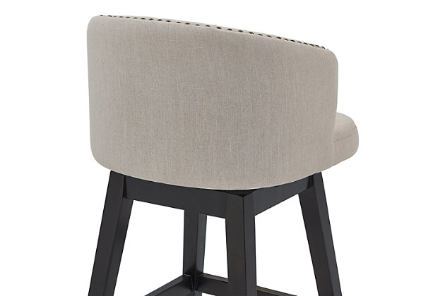 The Armen Living Celine wood barstool is an excellent choice for the transitional or contemporary household. Constructed from a combination of eucalyptus and birch wood frame that is certain to maintain its durability for many years to come. The Celine’s legs feature an Espresso wood finish and the plump, foam padded seat and back of the barstool are upholstered in tan fabric. The back of the Celine is rounded and features tufted accents that add a unique aesthetic accent to the piece. The barstool’s 360 degree swivel function allows for a wide range of movement while seated and the included footrest provides added comfort and support. The Celine’s legs are tipped with floor protectors, assuring that the barstool will not damage floors when moved. The Celine is sold in two industry standard sizes; 26 inch counter and 30 inch bar height. This wood barstool is available in gray or tan fabric.Celine contemporary bar or counter stool in espresso wood finish and grey or tan fabric | 360 degree swivel function allows for enhanced mobility while seated | Tufted back design is aesthetically pleasing and enjoyable | Product dimensions: 21"w x 21.5"d x 35"h sh: 26"