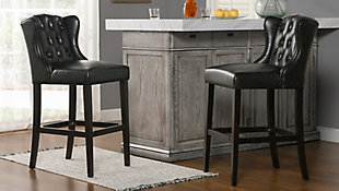 The Richmond Bar Stool Collection by Jennifer Taylor Home fits all your bar stool needs in a classic and comfortable wingback silhouette. The solid birchwood construction in a dark walnut finish pair perfectly with the deep brown faux leather upholstery. Easily wipe away messes from the durable, crack- and peel-resistant fabric, best for the most highly trafficked and mess prone areas of your home such as your kitchen, dining island and dining room. The quality build of each piece begins with a skilled furniture artisan who assembles each piece by hand so you can count on the Richmond bar and counter stools for years to come.Handmade by master furniture craftsmen for the highest level of quality | Sturdy frame of solid wood and sinuous springs provides excellent support and stability | Brass-plated footrest provides comfortable seating and resists scuffs and scratches | Upholstered in peel and crack resistant faux leather for easy cleaning and durability | Hand pulled button tufting and wingback silhouette for style, comfort, and support | Available in 30" and 26" seat heights for bars and counters