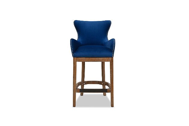 For a statement at any dining or island table, look to the Blake Bar Stool Collection by Jennifer Taylor Home. The beautifully curved silhouette of the arms and back is studded with nailheads for a bit of added detail. The low arms provide additional support while still allowing the stool to be pushed in most counter tables when not in use. The footrest is at a perfect height to rest your legs with an added brass kickplate to protect the solid wood frame. The 26" height of this stool is perfect for any counter-height table including your kitchen island, dining table, or a bar or game room setup.Handmade by master furniture craftsmen for the highest level of quality | Sturdy frame of kiln-dried solid birchwood and layered plywood provides excellent support and stability | Upholstered in velvet atop a high-density foam cushion for a medium firm feel | Dust-lined high-strength sinuous spring suspension provides long lasting comfort and style | Easy clean and durable 100% Polyester upholstery fabric | Foot rest for easy seating and comfort