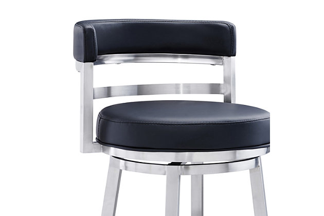 The Armen Living Madrid  armless barstool features a unique aesthetic that is certain to work well in any modern household. The Madrid’s durable brushed stainless steel frame is accompanied beautifully by its black faux leather seat and back. The upholstered low back is rounded, providing the user with exceptional support while the 360 degree swivel seat allows for enhanced mobility. The Madrid’s contemporary straight leg design endows the barstool with a chic quality that is further accented by the inclusion of a round footrest. The Madrid’s legs are tipped with floor protectors, assuring that the barstool will not slip on or scratch hardwood or tile floors. The beautiful Madrid is available in two industry standard sizes; 26 inch counter and 30 inch bar height.Sturdy construction for years of enjoyment | Available in two industry standard sizes; 26 inch counter and 30 inch bar height | Round foot rest adds a nice stylistic accent while balancing the barstool | Product dimensions: 20"w x 21"d x 34.5"h sh: 26" | Round footrest with brushed chrome-tone finish | Floor protectors | Available in 26" counter and 30" bar height | Assembly required | Comes with a standard 1-year limited warranty