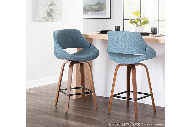 The wide and welcoming seat of the LumiSource Fabrico Counter Stool beckons one to sit and relax. A curved back and contoured upholstered seat is accented by flared walnut wood legs that add to the stylish yet comfortable design. Available in a variety of upholstery colors, choose the one that suits your space best.Mid-century modern styling | Fixed counter height with 360 degree swivel seat | Padded seat and backrest for added comfort | Round built-in footrest with black finish | Includes two counter stools