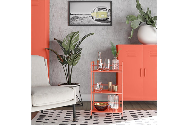 From the living room to the bathroom to the kitchen and beyond, the Novogratz Cache Metal Rolling Cart is a great addition to your home. Featuring a minimalistic style, the Cart has 3 shelves. Each shelf has 3 wrap-around bars and can hold up to 20 lbs. Place glasses, your favorite drinks, and decanter on the shelves for a stylish bar and serving cart or use as a craft cart or office cart to organize your printer, paper, and craft supplies. Easily roll the Cart from room to room on the 4 casters, 2 of which lock into place. The storage possibilities are endless with this versatile cart. Thanks to the orange powder-coated metal finish, this Cart will add a fun and funky pop of color to any space. The Cart ships flat to your door and requires assembly upon opening. Two adults are recommended to assemble. Once assembled, the Cart measures to be 30.11”H x 16.81”W x 11.4”D.Use the novogratz cache rolling cart anywhere you need to add storage space | The orange finish on the powder-coated metal adds a fun pop of color and can easily be cleaned by wiping with a damp cloth | Three shelves with wraparound bars on 3 sides allows you to organize glasses, toiletry items, craft supplies, and or make the cart into a fun coffee bar | The rolling casters make it easy to move the cart where ever you need and 2 casters lock to keep the cart in place | The cart ships flat to your door and 2 adults are recommended to assemble. Each shelf can hold up to 20 lbs. Assembled dimensions: 30.11”h x 16.81”w x 11.4”d | 1 year limited warranty is included