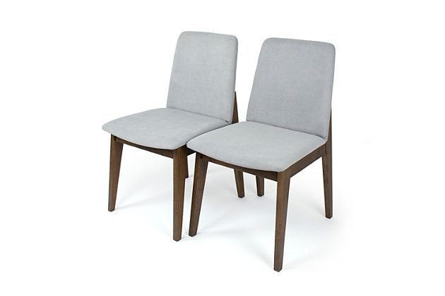 Add mid-century inspired character and warmth to your home with the Humble Crew Set of 2 Dining Accent Chairs, Grey Cushion Upholstered, Wood Legs. These contemporary armless chairs feature a sleek and versatile walnut wood finish and soft rounded corners that will easily complement your existing decor. The plush upholstered cushions pair style with comfort so you can use these chairs in your kitchen or dining room, at your desk, to accent your entryway or bedroom, or liven up your office or living room. This lovely set works great even in small spaces like apartments, dorm rooms, or teen workspaces. Each chair can hold a maximum of 400 lbs. Chairs are sold in a set of 2. The fabric on this chair is securely attached and not removable. Wipe fabric with a wet cloth to clean.  Easy to assemble with all hardware included. Product dimensions: 19"W x 22"D x 32"H. Seat height, 18".Set of 2 modern chairs perfect to complete any dining room, kitchen, bedroom or office. | Comfortable grey fabric upholstery, soft rounded corners, cushioned seat and back and walnut wood finish legs. | Can be used as a dining chair, desk chair or accent piece. | Stylish modern design complements existing decor. | Product sizing: 19"w x 22"d x 32"h. Seat height,18". Weight capacity, 400 lbs. | Easy to assemble. All hardware included.