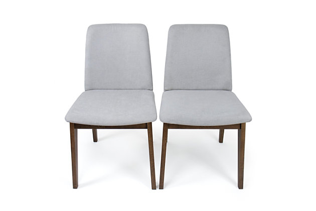Add mid-century inspired character and warmth to your home with the Humble Crew Set of 2 Dining Accent Chairs, Grey Cushion Upholstered, Wood Legs. These contemporary armless chairs feature a sleek and versatile walnut wood finish and soft rounded corners that will easily complement your existing decor. The plush upholstered cushions pair style with comfort so you can use these chairs in your kitchen or dining room, at your desk, to accent your entryway or bedroom, or liven up your office or living room. This lovely set works great even in small spaces like apartments, dorm rooms, or teen workspaces. Each chair can hold a maximum of 400 lbs. Chairs are sold in a set of 2. The fabric on this chair is securely attached and not removable. Wipe fabric with a wet cloth to clean.  Easy to assemble with all hardware included. Product dimensions: 19"W x 22"D x 32"H. Seat height, 18".Set of 2 modern chairs perfect to complete any dining room, kitchen, bedroom or office. | Comfortable grey fabric upholstery, soft rounded corners, cushioned seat and back and walnut wood finish legs. | Can be used as a dining chair, desk chair or accent piece. | Stylish modern design complements existing decor. | Product sizing: 19"w x 22"d x 32"h. Seat height,18". Weight capacity, 400 lbs. | Easy to assemble. All hardware included.