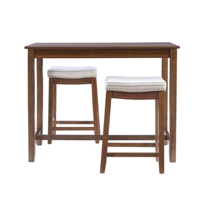 Dining table with two upholstered stools in a room setting