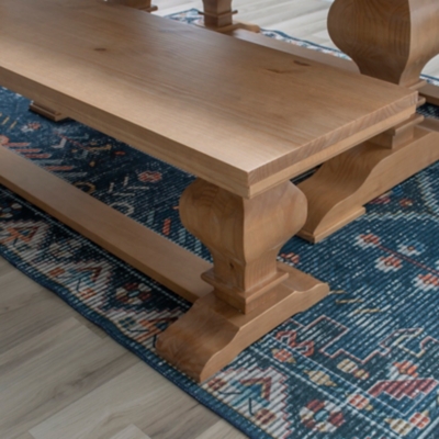 Low angle shot of bench base and feet on rug