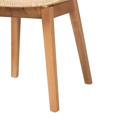 Close-up of the light wood legs and seat frame of the dining chair.