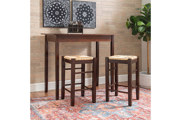 This 3-piece counter table set serves up style and space-saving convenience. Features a simple rectangular table on long, sturdy legs with two backless counter height stools with rice rush seats. Made from solid and engineered wood topped with a rich espresso finish. Stools tuck neatly under the table when not in use.Includes counter height table and 2 stools | Made of wood, engineered wood and rice rush | Assembly required