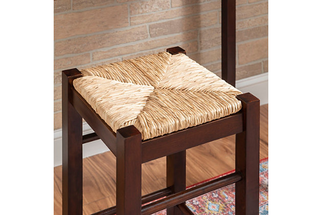 This 3-piece counter table set serves up style and space-saving convenience. Features a simple rectangular table on long, sturdy legs with two backless counter height stools with rice rush seats. Made from solid and engineered wood topped with a rich espresso finish. Stools tuck neatly under the table when not in use.Includes counter height table and 2 stools | Made of wood, engineered wood and rice rush | Assembly required