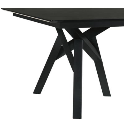 Side view of the black dining table showing pedestal-style angular legs