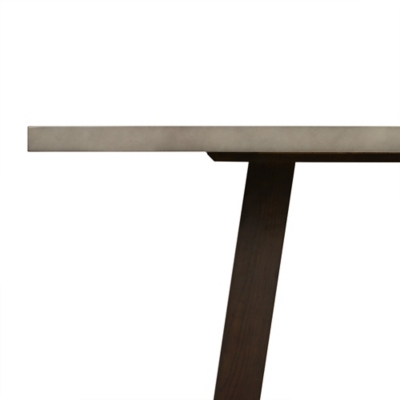 Side view focusing on the edge of the tabletop and one leg with a portion of the base visible