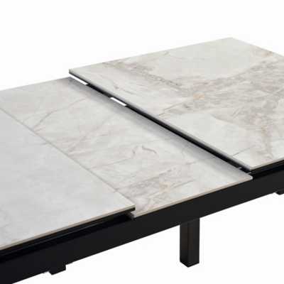Close-up of marble table top surface with veining and seam details.