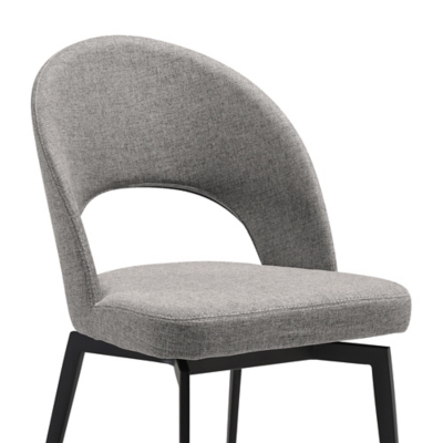 Grey upholstered dining chair with curved back and black metal legs, front view.