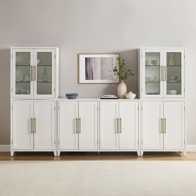 White storage cabinet unit with decorative items on top