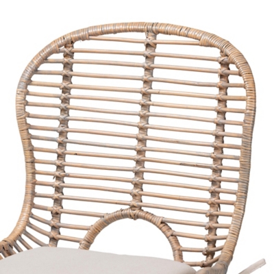 Close-up detail of the woven rattan backrest of the dining chair