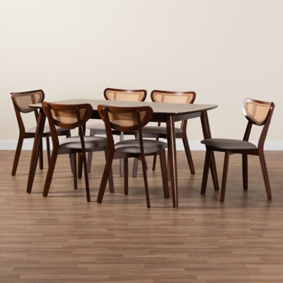 Six dining chairs around table in room