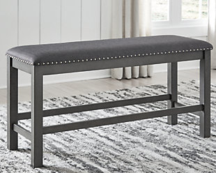Going gray in the best possible way. The Myshanna dining bench wows with an utterly on-trend smoky gray finish. Its softly cushioned seat with gray textured upholstery and nailhead trim will have you lingering a little longer at mealtime. Just a touch of distressing helps it fit right in with your modern farmhouse decor.Made with solid hardwood frames | Antiqued gray finish | Woven polyester upholstery | Nailhead accents | Seats up to 3 | Assembly required | Estimated Assembly Time: 15 Minutes