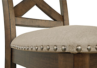 The Moriville upholstered bar stool might be simple at first sight, but a closer look reveals beauty in the details. With a distressed nutmeg finish, antiqued nailhead trim and textured polyester upholstery, it’s beaming with charm. Cushioned seat ensures long, lingering meals are enjoyed in comfort.Made of wood | Polyester upholstery | Nailhead trim with antiqued bronze-tone finish | Assembly required | Excluded from promotional discounts and coupons | Estimated Assembly Time: 45 Minutes