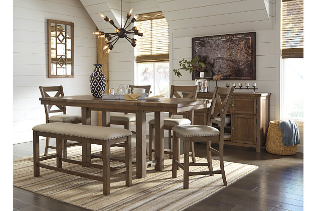 Moriville counter height dining table might be simple at first sight, but a closer look reveals beauty in the details. From the through-tenon pedestal base to the plank-effect table top and distressed nutmeg finish, Moriville is beaming with charm. Small scale is especially suited to loft-style living, but two optional leaves ensure there’s plenty of space for parties up to eight.Made of veneers, wood and engineered wood | Separate extension leaves | Table extends by pulling both ends and dropping in leaves | Seats up to 8 | Assembly required | Dining chairs sold separately | Estimated Assembly Time: 30 Minutes
