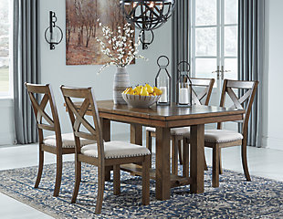 Moriville upholstered dining chair elevates the art of casual rustic style. With a distressed nutmeg finish, antiqued nailhead trim and textured polyester fabric, this upholstered dining chair with classic X back styling entices with warmth and earthy elegance. Cushioned seat accommodates lingering meals enjoyed in comfort.Made of wood | Polyester upholstery over foam cushioned seat | Nailhead trim with antiqued bronze-tone finish | Assembly required | Estimated Assembly Time: 30 Minutes