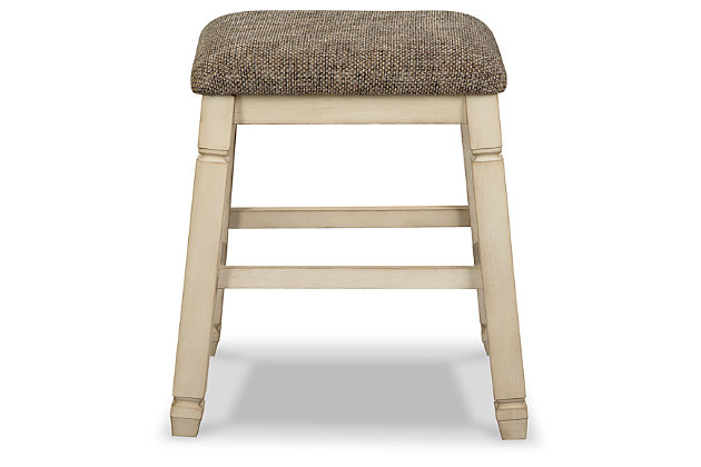 The beauty of the Bolanburg upholstered bar stool is something to savor. Designed to serve up comfort and flair, this backless bar stool entices with a saddle seat covered in a heavy woven fabric that complements the antiqued white finish.Made of solid wood | Antiqued white finish | Cushioned seat upholstered in heavy woven polyester fabric | Assembly required | Estimated Assembly Time: 30 Minutes