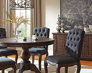 Indulge your upscale taste. Dressed to the nines with diamond button-tufted fabric, the Trudell upholstered dining room chair merges a richly elegant look with a sumptuously comfortable feel. Showcasing a complex finish with golden-brown contrasting, the dining room chair’s elegant cabriole legs are crafted of 100% hardwood for years of satisfaction.Solid wood legs | Diamond button-tufted polyester upholstery | Cushioned seat and back | Excluded from promotional discounts and coupons