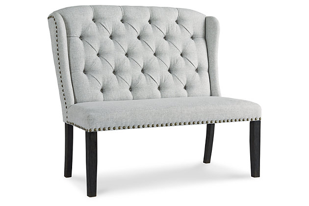 With its fashion-forward take on timeless wingback styling, the Jeanette upholstered dining bench is a feast for the senses. Richly neutral linen-weave upholstery is punctuated with nailhead trim for trendy flair. Deep button tufting enhances the luxurious look and feel that’s designed to make gathering around the table an easy-elegant experience.Made of wood | Polyester upholstery over foam cushioned seat | Button tufted back | Nailhead trim | Assembly required | Estimated Assembly Time: 15 Minutes