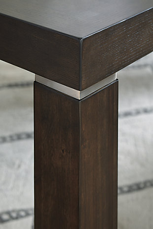 The Hyndell extension table serves up clean-lined, contemporary style with a sleek, linear profile and rich espresso finish. Fresh elements including a subtle geometric veneer inlay top and a floating effect Parsons leg keep this table relevant and on trend. The drop-in leaf makes entertaining drop-in guests a breeze.Made of wood, veneers and engineered wood | Dark espresso brown finish | Bright nickel-tone metal band on table legs | Separate extension leaf | Table extends by pulling both ends and dropping in leaf | Seats up to 8 | Dining chairs sold separately | Assembly required | Estimated Assembly Time: 30 Minutes
