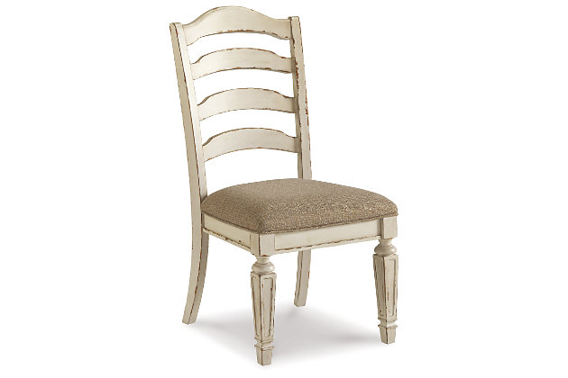Bon appétit. With its rounded ladderback styling, chipped white finish and plushly cushioned seat, the Realyn dining room chair has all the right ingredients for a French country-inspired feast for the eyes.Made with wood and engineered wood | Distressed, chipped white finish | Ladderback styling | Polyester upholstery over foam cushioned seat | Assembly required | Estimated Assembly Time: 30 Minutes