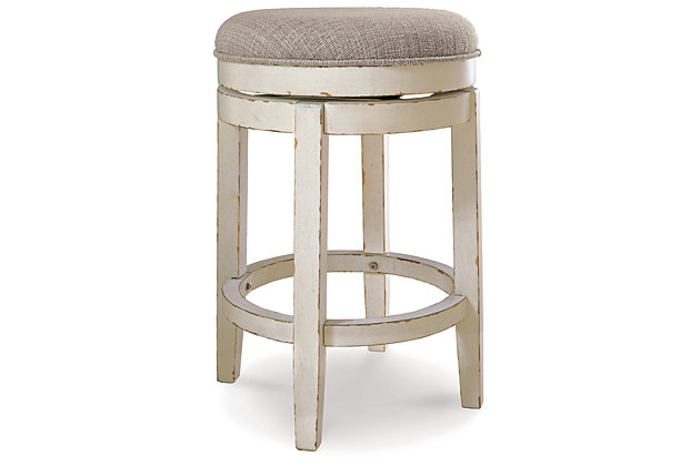 Give traditional cottage design a spin with the Realyn upholstered swivel stool. Sturdy wood frame is enriched with a chipped white finish and topped with a comfortably cushioned seat covered in textured oatmeal-tone fabric.Made of wood | Chipped white finish | Foam cushioned seat with textured polyester oatmeal-color fabric | 360-degree swivel | Assembly required | Estimated Assembly Time: 15 Minutes
