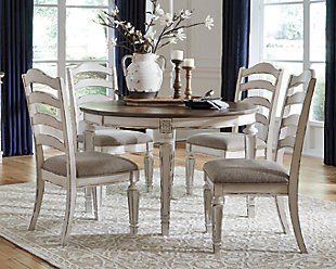 Bon appétit. The Realyn 5-piece dining room set has all the right ingredients for a French country-inspired feast for the eyes. Drop-in leaf allows you to transform the intimate round dining table into a gracious oval table that comfortably seats six. Antiqued two-tone aesthetic pairs chipped white with a distressed wood finished top for a double serving of charm. With its rounded ladderback styling and plushly cushioned seat, this dining room chair is sure to entice you to linger a little longer.Includes dining table and 4 chairs | Assembly required | Table made of veneer, wood and engineered wood | Antiqued two-tone finish | Separate extension leaf | Table extends by pulling both ends and dropping in leaf | Table seats up to 6 | Chair made with wood and engineered wood | Distressed, chipped white finish | Ladderback styling | Polyester upholstery over foam cushioned seat | Estimated Assembly Time: 135 Minutes