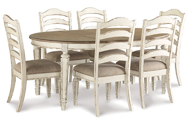 Bon appétit. The Realyn 7-piece dining room set has all the right ingredients for a French country-inspired feast for the eyes. Drop-in leaf allows you to transform the intimate round dining table into a gracious oval table that comfortably seats six. Antiqued two-tone aesthetic pairs chipped white with a distressed wood finished top for a double serving of charm. With its rounded ladderback styling and plushly cushioned seat, this dining room chair is sure to entice you to linger a little longer.Includes dining table and 6 chairs | Assembly required | Table made of veneer, wood and engineered wood | Antiqued two-tone finish | Separate extension leaf | Table extends by pulling both ends and dropping in leaf | Table seats up to 6 | Chair made with wood and engineered wood | Distressed, chipped white finish | Ladderback styling | Polyester upholstery over foam cushioned seat | Estimated Assembly Time: 195 Minutes