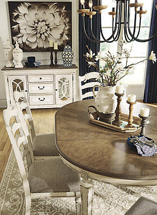 Bon appétit. The Realyn dining room extension table has all the right ingredients for a French country-inspired feast for the eyes. Drop-in leaf allows you to transform an intimate round dining table into a gracious oval dining table that comfortably seats six. Antiqued two-tone aesthetic pairs a chipped white with a distressed wood finished top for a double serving of charm.Made of veneers, wood and engineered wood | Antiqued two-tone finish | Separate extension leaf | Table extends by pulling both ends and dropping in leaf | Seats up to 6 | Dining chairs sold separately | Assembly required | Estimated Assembly Time: 15 Minutes