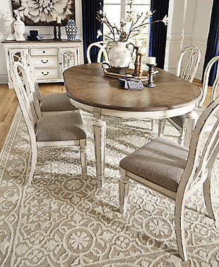 French twist. With its stylized ribbon back, chipped white finish and plushly cushioned seat, the Realyn dining room chair has all the right ingredients for a French country-inspired feast for the eyes.Made with wood and engineered wood | Distressed, chipped white finish | Stylized ribbon back design | Polyester upholstery over foam cushioned seat | Assembly required | Estimated Assembly Time: 30 Minutes