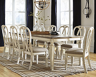 Bon appétit. The Realyn 9-piece dining room set has all the right ingredients for a French country-inspired feast for the eyes. Drop-in leaf allows you to transform the intimate square dining table into a gracious extension table that comfortably seats eight. Antiqued two-tone aesthetic pairs chipped white with a distressed wood finished top for a double serving of charm. With its stylized ribbon back design and plushly cushioned seat, this dining room chair is sure to entice you to linger a little longer.Includes dining table and 8 chairs | Assembly required | Table made of veneer, wood and engineered wood | Antiqued two-tone finish | Separate extension leaf | Table extends by pulling both ends and dropping in leaf | Table seats up to 8 | Chair made with wood and engineered wood | Distressed, chipped white finish | Stylized ribbon back design  | Polyester upholstery over foam cushioned seat | Estimated Assembly Time: 270 Minutes