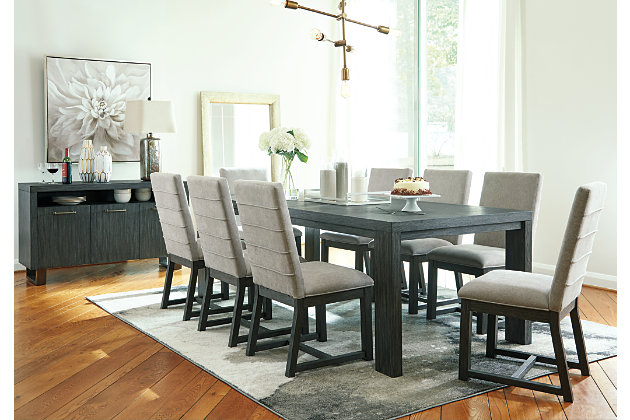 Discover contemporary style you can comfortably live with in the Bellvern 9-piece dining set. Strikingly simple but with a “hefty” presence, this clean-lined extension table is loaded with character that includes a wire-brushed texture with a complex blackened finish and contrasting gray undertones. The upholstered dining chairs are wrapped front and back with a feel-good pumice gray fabric for a sense of earthy elegance. Posh pleats make the modern aesthetic complete.Includes extension table and 8 side chairs | Table made of acacia wood, oak veneers and engineered wood with blackened finish with gray undertones and wire-brushed texture | Table with separate extension leaf extends by pulling both ends and dropping in leaf | Table seats up to 8 | Chairs made of wood with blackened finish with gray undertones and wire-brushed texture | Chairs with polyester upholstery in pumice gray over foam cushion with pleated fabric details | Assembly required | Estimated Assembly Time: 270 Minutes
