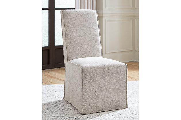 Balancing chic flair with a relaxed sensibility, the Langford skirted side chair strikes just the right tone for rustic sophistication. Creamy beige upholstery and sumptuous cushioning make this chair the epitome of easy elegance, while its gracefully tailored seat-to-floor skirt design adds another layer of dimension. Made of wood | Complex blend of stain and glaze creates a weathered gray finish with distressed texture | Creamy beige woven polyester upholstery | Fully upholstered seat and back with seat-to-floor skirt | Foam cushioning | Assembly required