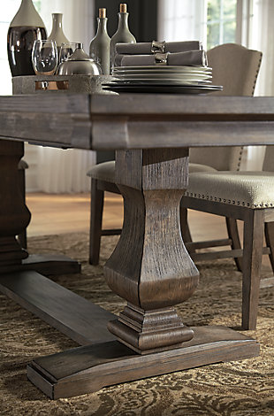 Alluring in a distressed weathered gray finish, the Johnelle 6-piece dining set makes your homestead feel that much more like home. A richly crafted masterpiece, this handsome extension table with thick drop-in leaf has a double pedestal base with square baluster legs and is sure to serve up years of satisfaction. The dining server includes lined drawers and adjustable shelving has the capacity to put your plates, silverware, linens and serving essentials well within reach. Fresh and neutral linen-weave upholstery on the chairs is punctuated with contrasting nailhead trim for added character.Includes extension dining table, dining server and 4 dining side chairs | Table made of veneers, pine and acacia wood and engineered wood | Server made of elm veneers, solid wood and engineered wood with dark gray pewter-tone hardware | Distressed weathered gray finish | Table includes extension leaf and extends by pulling both ends and dropping in leaf | Table seats up to 8 | Server with 2 felt-lined silverware drawers, 3 cabinet doors and 3 adjustable shelves | Chairs made of solid wood | Polyester upholstery over foam cushioned seat | Contrasting nailhead trim | Assembly required | Estimated Assembly Time: 170 Minutes