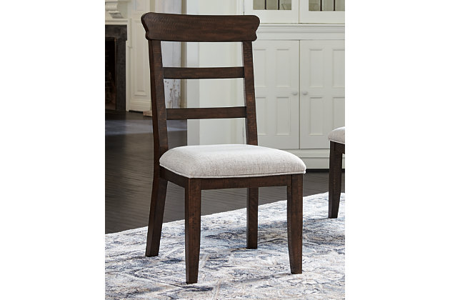With its sturdy silhouette and lively, dark brown distressed finish, the Hillcott dining room upholstered chair gives modern farmhouse styling a rich, substantial sensibility. Comfortably cushioned seat is covered in a light beige fabric sure to complement your decor.Made of wood | Light beige polyester upholstery over foam cushioned seat | Dark brown distressed finish | Assembly required | Estimated Assembly Time: 30 Minutes